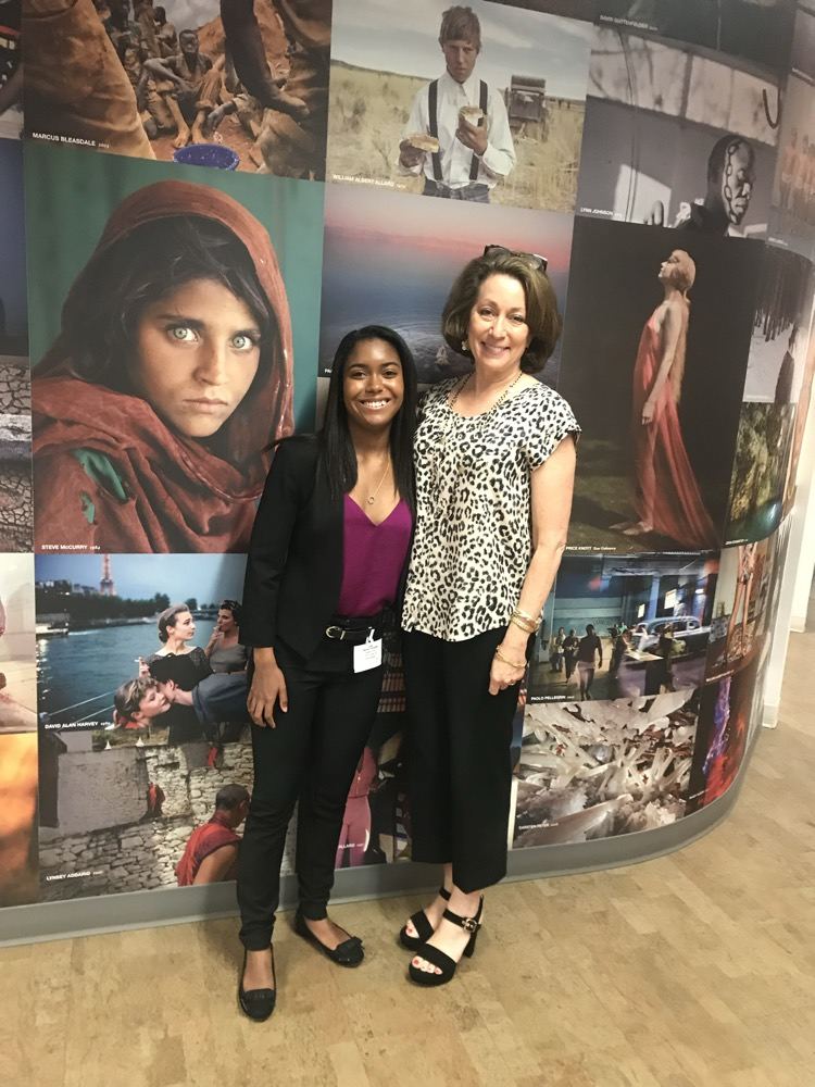 Danielle with former National Geographic Editor in Chief Susan Goldberg at the photo wall, the Afghan Girl portrait behind them