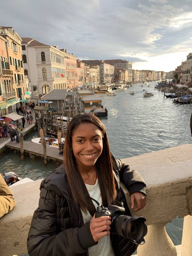 Danielle smiling on a bridge above the Grand Canal in Venice