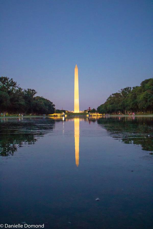 The Washington Monument mirrored in still water at dusk